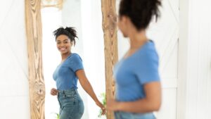 happy woman mirror weight loss