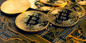 bitcoin coins sitting on computer chip btc gID 7.jpg@png