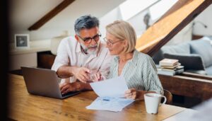 older couple working documents