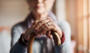 woman holding cane